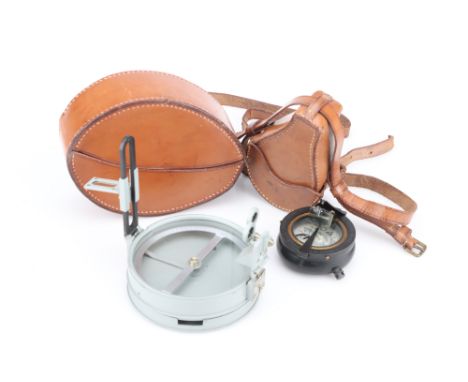 Two Compasses,comprising of a field compass, stamped 'CREACHE-OSBORNE COMPASS, H.UGES, LONDON, 1915' in a leather case, the o