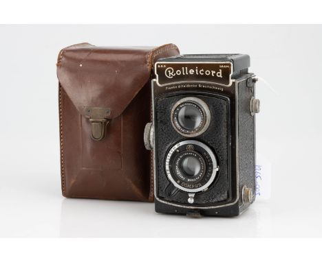 A Rollei Rolleicord Ia Medium Format TLR Camera,black, body F, signs of heavy use, shutter working but speeds slow, with Tess