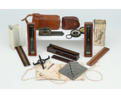 Collection of Surveying Instruments,comprising three trough compasses with two in mahogany cases and one in a bakelite case, 