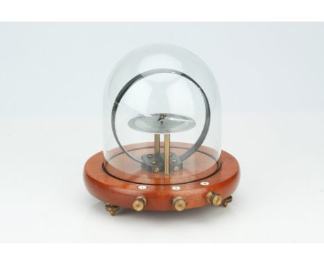 A Tangent Galvanometer Under a Glass Dome,English, c.1920, signed to the dial Philip Harris Birmingham, on a polished mahogan