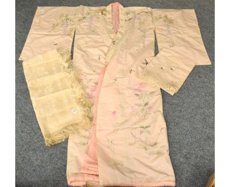 A 20th Century Oriental Cream Silk Robe embroidered with a crane, with a pink silk lining and sash; and A 19th Century Cream 