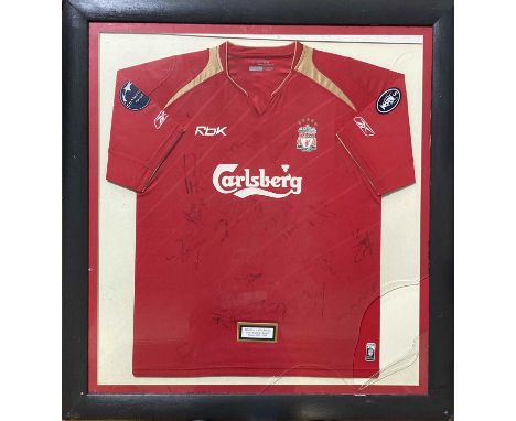 A mounted and framed display to include a circa 2005/6 season Liverpool shirt signed by many members of the playing squad fro