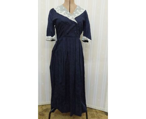 Vintage Laura Ashley blue cotton dress with lace collar and lace cuffs to three-quarter sleeves, four button front fastening 