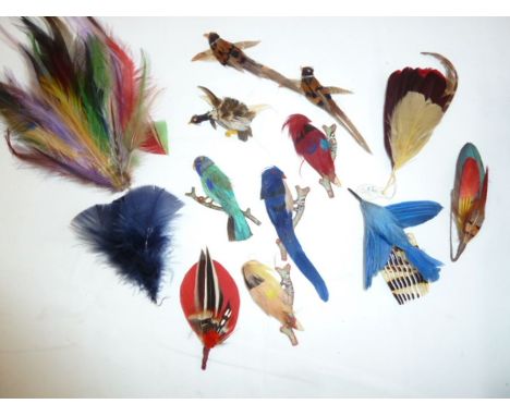 Quantity of assorted feathers, hats and hair decorations, to include bird brooches made of the feathers, and some adornments 