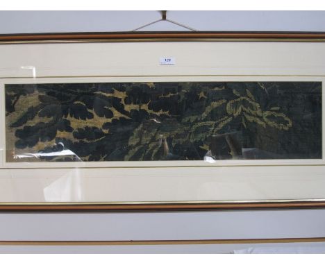 Possibly 18th century embroidered tapestry section of green leaves on a beige border, 19cm x 76cm Condition ReportFrame appro