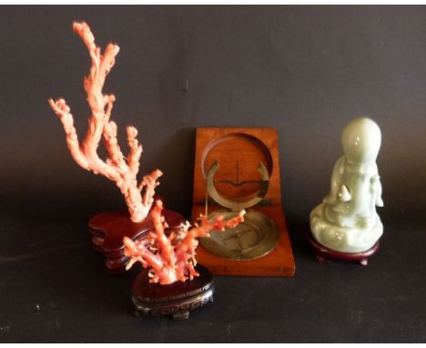 A 20th Century Coral Carving upon hardwood stand, together with another similar, a Chinese patinated compass within mahogany 