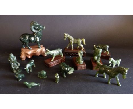 A Collection of Early 20th Century Chinese Jade Models of Animals, some upon hardwood stands