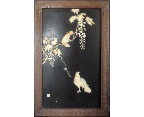 A Japanese Carved Ivory Rectangular Plaque depicting exotic birds amongst foliage, signed, 60 x 35 cms