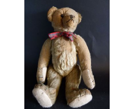 An Early 20th Century Steiff Teddy Bear, with jointed body (button missing)