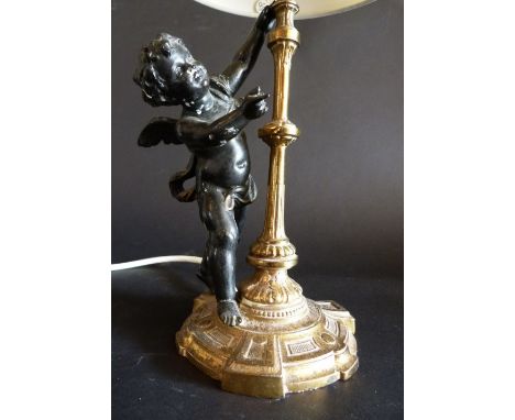 A Brass and Patinated Metal Table Lamp in the form of Putti, 25 cms tall