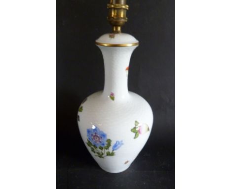 A Herend Porcelain Table Lamp, decorated in polychrome enamels with a foliate design upon a white ground, 29 cms high