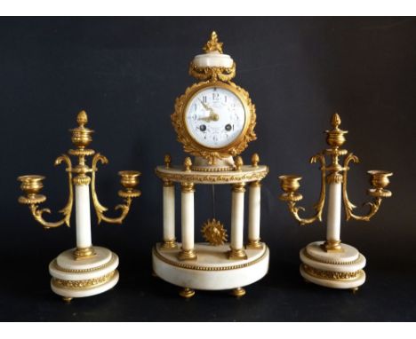 A Late 19th Early 20th Century French Marble and Gilt Metal Three Piece Clock Garniture, the portico clock with an enamel dia