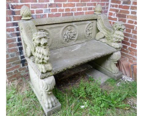 A Weathered Cast Concrete Garden Bench with lion paw feet, 144 cms wide