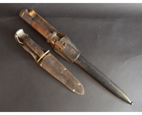 A Second World War German V2-24 Bayonet with metal scabbard and leather belt clip, reportedly taken from a German soldier by 