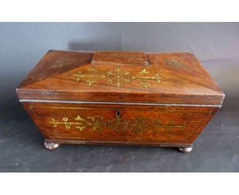 A Regency Rosewood Brass Inlaid Sarcophagus Shaped Tea Caddy, the hinged top enclosing a fitted interior with central blendin