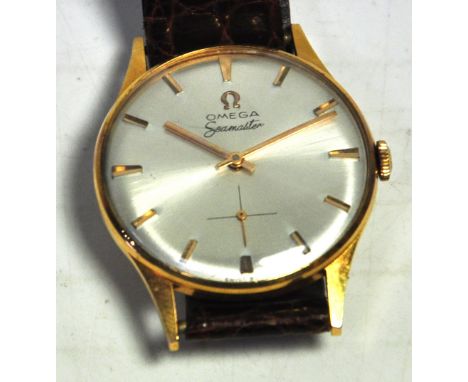 Omega; a gentlmans vintage 18ct yellow gold Seamaster wristwatch with circular dial set with gold batons, the reverse of case