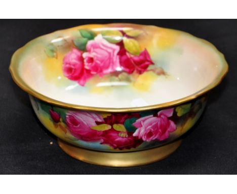 A Royal Worcester bowl decorated with sprays of roses and gilded, signed M. Hunt, puce marks to the base, diameter 22cm. COND