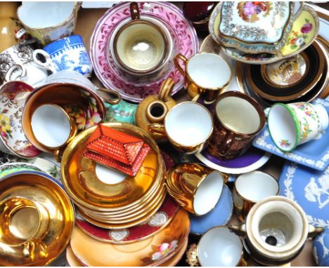 A quantity of ceramics to include blue Wedgwood jasper ware, pin trays, Continental pill boxes and further decorative cups an