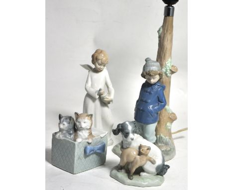 Four Nao figures, an angelic girl, two cats in a basket, a cat and dog and a lamp in the form of a boy by a tree (4).