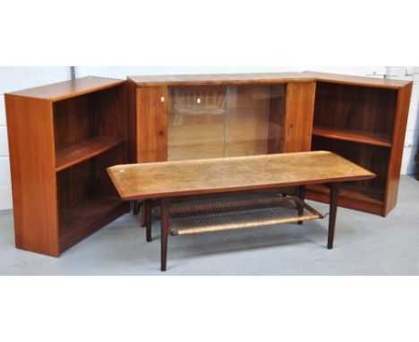 A retro Italian coffee table with lower rattan shelf, a pair of mahogany bookcases and one other glazed bookcases on splayed 