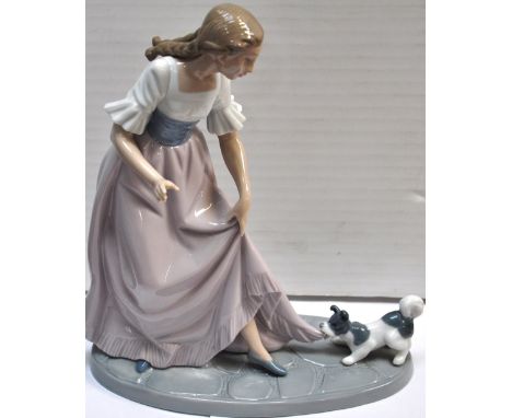 A large Nao figure of a girl with a dog.