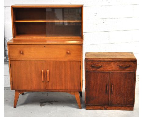 A 1970s retro light oak Golden Key side cabinet with glazed top section with internal tier and lower long drawer above two do