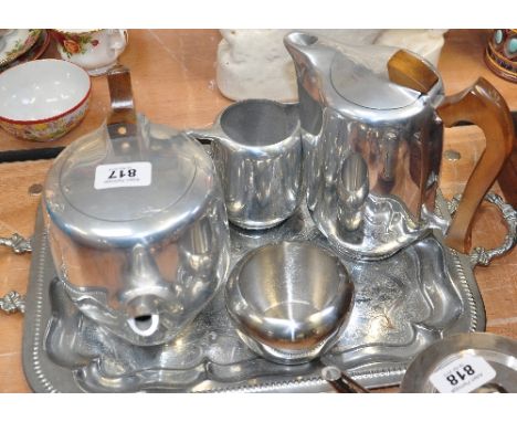 A Picquot ware tea set comprising coffee pot, teapot, milk jug and sugar basin together with an unrelated tray.