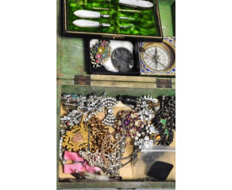 A quantity of costume jewellery to include brooches, necklaces, some vintage jewellery and a yellow metal stick pin with a sm