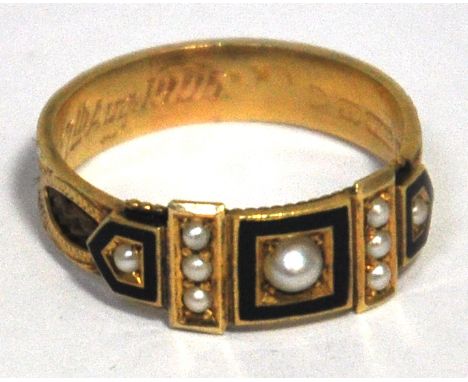 An Edwardian 15ct gold black enamelled and cultured pearl mourning ring the central rectangular black enamel platform set wit