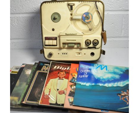 A 1960s vintage Telefunken "Magnetohon 75" reel to reel portable tape recorder and a small quantity of vinyl albums.