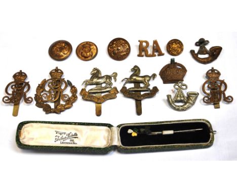 SEAN RICE (1931-1997); a collection of military cap badges and buttons, two stick pins one set with pierced hardstone the sec