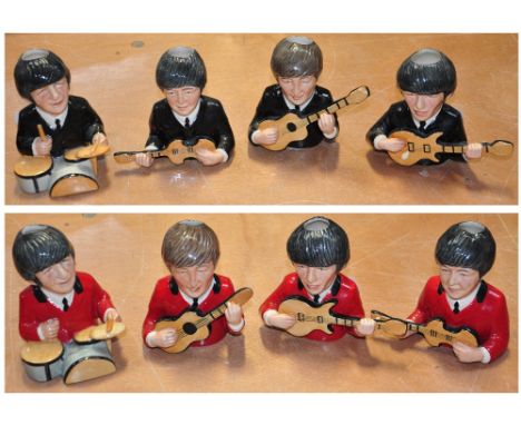 Eight small ceramic models of The Beatles.