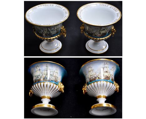 A boxed pair of Royal Worcester lion mask handle vases, "HMS Victory" and "HMS Victory & Bucentaure" both from the Nelson col