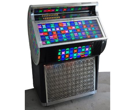 A 1973 Seeburg "Carnival" jukebox model SL100. Pre-loaded with twenty-nine disks and complete with original operation manual,