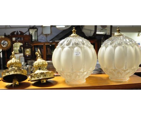 A 20th century oak standard lamp and two glass globe and gilt metal hanging light shades (3).