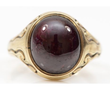 A George VI 9ct gold filled gentleman's foil backed garnet signet ring, makers mark CG, Birmingham 1941, with embossed scroll