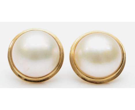 A pair of 375 gold mounted mabe pearl ear studs, 15mmCondition report - the posts are a little misshapen and the pearls have 