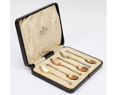 An Art Deco silver and polychrome enamel set of six coffee spoons, 10cm, 63gm, case 