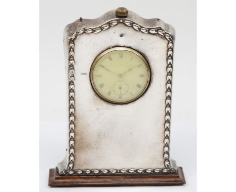 A silver fronted and oak mantel clock, Birmingham 1913, with wheatsheaf border, with Vertex pocket watch watch movement, 15 x