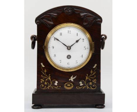 An early 20th century inlaid mahogany cased dome topped mantle clock, inlaid with brass and mother of pearl, the white enamel
