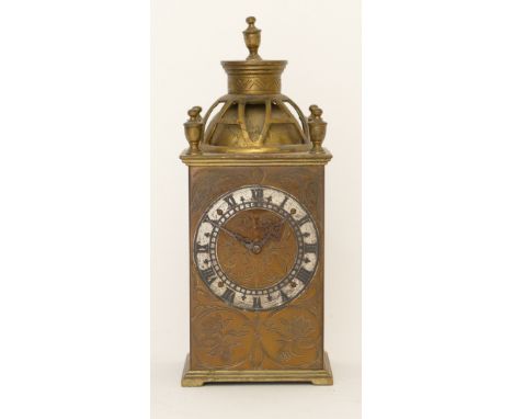 An engraved brass cased mantle clock, the Swiss lever escapement movement striking on a bell with pierced 'A' shaped decorati