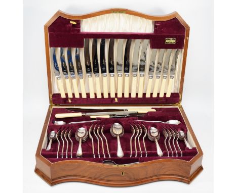 A 20th century walnut cased serpentine fronted 'King Henry' canteen of plated flatware for eight place settings, comprising o