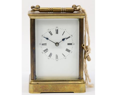 A 20th century brass corniche cased half hourly striking carriage clock, the white dial with black Roman numerals, 17cm high.
