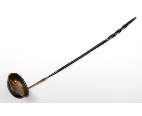 A Georgian silver toddy ladle, makers marks WW, lion passant, and whale bone twist handle, 34cm, 32gm. 