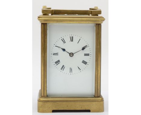 A 20th century brass corniche cased striking mantle clock, striking on the hour and half hour, striking on a gong, the white 