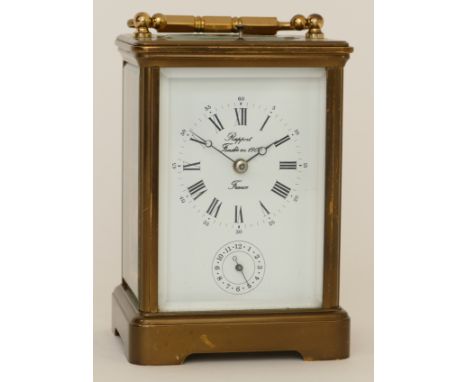 Rapport, a 20th century French brass corniche cased striking alarm carriage clock, the white dial with black Roman numerals, 