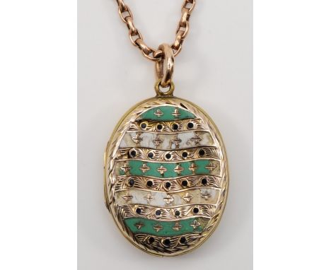 A Victorian gold front and backed enamel oval locket, 31 x 22mm, unmarked, with a 9ct gold chain, chain weight 4.4gm. 