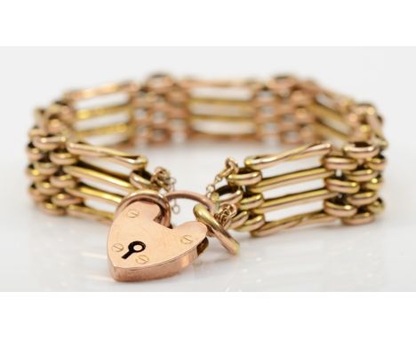 A Victorian 9ct gold gate link bracelet with heart shaped padlock clasp, safety chain, 18cm, 16.3gm. 