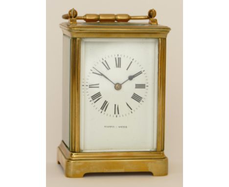 Mappin &amp; Webb; a 20th century brass corniche cased hourly striking carriage clock, strikes on a gong, the white dial with