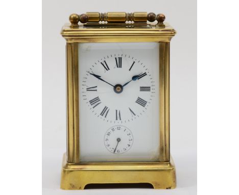 A French brass corniche cased hourly striking carriage clock, movement striking on a bell, the white dial with black Roman nu